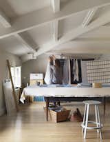 Office, Craft Room Room Type, Light Hardwood Floor, and Desk Lone, a textile designer, has a studio in the loft. Chris also has a workshop on this floor, where he makes guitars.  Photos from See What Happens When Two Hard-Core Modernists Are Let Loose in a Medieval Townhouse in France