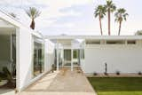 Outdoor, Grass, Back Yard, Hardscapes, Large Patio, Porch, Deck, and Decomposed Granite Patio, Porch, Deck Landscape company The Backyard was hired to enhance the outdoor spaces. Voids in the overhanging roof partially frame the mountain in the distance.   Photos from Ex Alt-Rockers Revive a Midcentury Gem Near Palm Springs—and Find it May Be a Lost Masterpiece