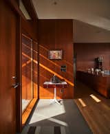 Original architect Roscoe Hemenway wrapped the interior of the house in Douglas fir paneling, which the new owners replaced with