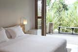 Bedroom, Bed, Night Stands, Wall Lighting, and Concrete Floor  Photo 8 of 9 in Casa Mar Paraty by Dwell