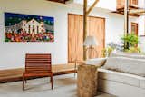 Living Room, Sofa, Chair, End Tables, Table Lighting, and Concrete Floor Casa Mar Paraty in Praia Grande, Party, Brazil  Photo 3 of 9 in Casa Mar Paraty by Dwell from 8 Brazilian Getaways to Book Now That U.S. Visitors Don’t Need Visas