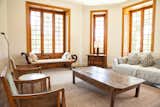 Living Room, Medium Hardwood Floor, Rug Floor, Coffee Tables, Chair, and Sofa  Photo 13 of 14 in Casa Marques Jardim Botanico by Dwell