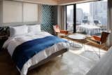 Bedroom, Chair, Night Stands, Table Lighting, Bed, and Medium Hardwood Floor  Photo 5 of 11 in Wired Hotel Asakusa by Dwell