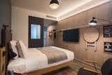 Bedroom, Wall Lighting, Dark Hardwood Floor, Ceiling Lighting, and Bed  Photos from Moxy Osaka Honmachi