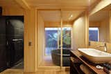 Bath Room, Medium Hardwood Floor, Soaking Tub, Wood Counter, and Vessel Sink  Photo 6 of 10 in Kyomachiya Hotel Shiki Juraku by Dwell