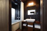 Bath Room, Full Shower, Vessel Sink, Wood Counter, Soaking Tub, and Wall Lighting  Photo 7 of 10 in Kyomachiya Hotel Shiki Juraku by Dwell