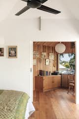 The master bedroom opens to the paneled study, which doubles as a bedroom for visiting grandchildren.