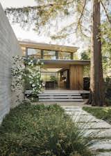 Recently retired and ready to downsize, Paul and Melonie Brophy found a lot in Palo Alto that gave them the chance to start fresh. Their glass, concrete, and wood house, designed by Feldman Architecture, seems to float above a landscape by Bernard Trainor. Of the board-formed concrete wall, architect Taisuke Ikegami says, "It connects the building to the ground plane while allowing the house to be a landscape element."