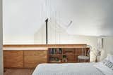 The guest loft features a bed from West Elm and custom plywood casework  by Kansas City artisan Haynes Nichols.