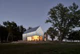 Exterior, House Building Type, Stone Siding Material, Metal Siding Material, Gable RoofLine, and Metal Roof Material  Photos from A Limestone Cottage in Kansas Is Reborn With a Corrugated Steel Addition