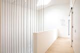 A geometric wire sculpture by artist Antonino Sciortino hangs near the bedroom entrance.