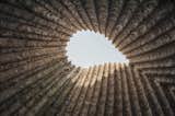 The Bruder Klaus Field Chapel's rammed-concrete walls were shaped around a form made from rough pine logs, which were then slowly burned away.  Photo 5 of 9 in “It’s All About Emotion”: A Conversation With Peter Zumthor