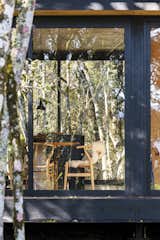 Exterior, House Building Type, Glass Siding Material, and Metal Siding Material Of their decision to use wood for their line of prefab dwellings, architect Diego Morera says, “We love wood—from its scent, feel, and thermal properties to its durability and resistance.”  Photos from A Brazilian Couple’s Prefab Cabin Is the Perfect Outpost for Forest Bathing