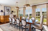 A series of French doors line the dining room, fostering another harmonious transition to the outdoors.