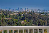 Perched atop a canyon in Brentwood, the home offers striking city views in the distance.