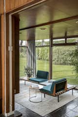 Living, End Tables, Bench, Slate, Rug, Chair, Ceiling, and Recessed Side table by Oliver Bonas.  Living Bench Ceiling Slate Photos from A Designer Couple Restore a British Modern Masterpiece