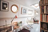 Featuring a thoughtful curation of collected antiques and retro pieces, the boat has also been fitted with custom-built furniture, including the bookshelves, sofa, and kitchen table.
