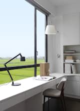 The desk lamp is from Vipp and the chair and wall lamp were designed by André.