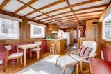 The boat's midcentury-inspired interior features beautiful exposed wood beams.