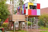 Known as St. Martin, this colorful tree house serves as a habitat and development center for children and adolescents with cognitive impairments. By collaborating with a garden architect, the team developed a spectrum of colors for the playful, patchwork-like facade.