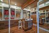 The master suite also includes a spacious walk-in closet with restored cabinetry.