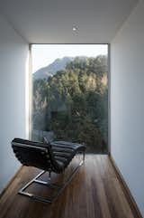 Designed by Shanghai-based Bengo Studio, the Qiyunshan Tree House is a small hotel in China’s Qiyun Mountain Scenic Area that includes seven stacked, cantilevered guest suites connected by a central spiral staircase. At the top of the structure, a minimalist reading room features a floor-to-ceiling window that frames the lush mountain view.&nbsp;