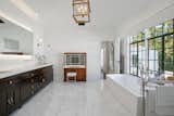 Bath Room, Ceramic Tile Wall, Freestanding Tub, Drop In Sink, Marble Floor, Recessed Lighting, Ceiling Lighting, and Travertine Floor A look at one of the seven bathrooms.  Photos from Beck’s Former Mediterranean-Style Retreat Lists For $8M
