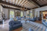 Restored wooden beams line the ceilings of several rooms throughout the home.