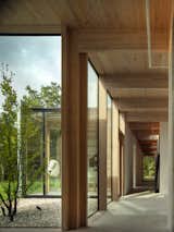 To create a low-energy house, several passive environmental strategies have been incorporated into the home, including a heated floor system and exterior automated wood blinds. "Natural air ventilation in every room and cross-ventilation between opposite facades keeps the need for air conditioning to a minimum,