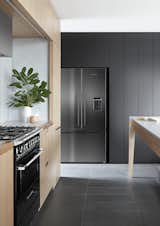 Kitchen, Range Hood, Slate, Range, Wood, and Refrigerator A brand new line of black appliances from Fisher &amp; Paykel provides even more style choices.  Kitchen Wood Range Refrigerator Range Hood Photos from An Australian Kitchen Is Reimagined With Sleek Black Appliances