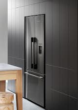 Kitchen, Wood Cabinet, and Refrigerator “We would normally integrate the fridge, but this French Door refrigerator looked so good we were happy to keep it exposed,” comments Josie Sommerville of Whiting Architects.  Search “hz so good” from An Australian Kitchen Is Reimagined With Sleek Black Appliances