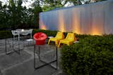 Outdoor, Metal, Concrete, Landscape, Garden, Shrubs, and Vertical With ample seating and an illuminated landscape, the backyard can facilitate easy entertaining.  Outdoor Metal Shrubs Landscape Photos from A Lustron Steel Prefab in Pristine Condition Lists For $350K