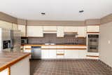 The spacious kitchen comes with all new appliances, including two built-in wall ovens.