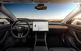 A view from inside Tesla's Model 3 shows the car's sleek, streamlined interior.