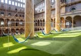 Hammocks allow guests to bask in the museum's sunny great hall.