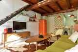 This colorful cottage (complete with garden, midcentury modern decor, and a spiral staircase) is located in the historical San Lorenzo neighborhood near Sapienza University. Bars, restaurants, and public transport abound in this bohemian locale.