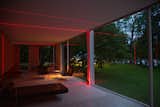 A view from inside the Farnsworth House shows the laser beams at play with the surrounding environment. 