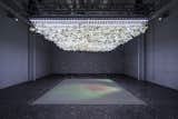 As attendees enter the exhibit, flower petals will begin to fall from the ceiling. Light and sound will slowly morph to create a meditative space.