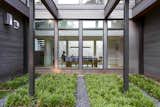 Ten-foot windows frame views of a Zen garden built along the exterior of the home.&nbsp;