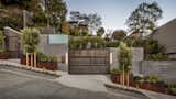 Guests can enter the three-story property via a street-side gate with a built-in Siedle Steel electronic entry system, including a keypad and biometric access. Alternatively, the home offers an underground four-car garage.