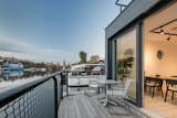 A private deck along the rear of the home offers space for enjoying sunsets over the water. Although only minutes from downtown Prague, the setting feels much further away.