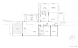 A look at the new layout. The original four-room cottage now houses a separate living area, study, and master suite. In the extension, an open living/dining area provides a large gathering area in the back, while two bedrooms and a new full bathroom are at the front.