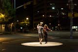“People may have ignored it completely,” says Surtees, “but people would see it, and if someone else was close to them they’d start interacting with one another through the spotlight on the floor, or they may just walk through and click their heels. It became really an invitation to think about their relationship with public space through light.”  Photo 9 of 10 in RM-3 Episode Six: Light