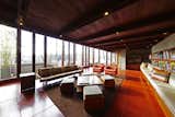 Floor-to-ceiling windows line the living area of the midcentury Usonian, allowing natural light to pour in. 