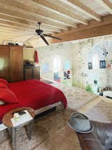 For the homeowner, openness and flexibility were the main priorities. That desire is visible in the two-story loft that Tas uses for his bedroom and studio space. “Privacy in the home was not a huge issue for me,” says Tas. “I only invite my most intimate friends here anyway.” Garmendia is a regular guest at the house—he even has his own set of keys to come and go as he pleases.
