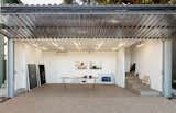 Shed & Studio Frohn glued layers of plywood and linoleum together to fashion the work table  Photos from A Corrugated, Plastic Bifold Door Opens Up an Artist’s Tiny L.A. Studio