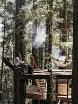 To date, the pair and their pals  have built a compound complete with sheds, tree decks, a pavilion, a wood-fired hot tub, an outhouse, an outdoor shower, and, now, a redwood cabin where an ever widening network of friends gather for skill-sharing workshops and events.