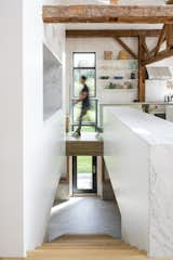 Near the kitchen a stairwell leads down to the basement and a side patio.