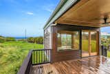 Outdoor A covered lanai offers space for relaxing or entertaining in the tropical year-round climate.  Photo 3 of 13 in A Breezy Prefab on Hawaii’s Big Island Lists For $379K
