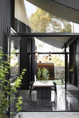 Bifold sliding doors open up both sides of the home to exterior courtyards.